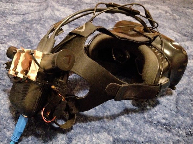 HTC Vive headset with Vive Wireless Adapter and two 40mm fans held on with cable ties