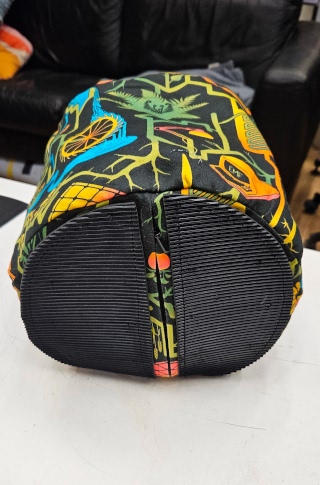 [Doorstop on its side with rubber stitched to the bottom, either side of the zip]